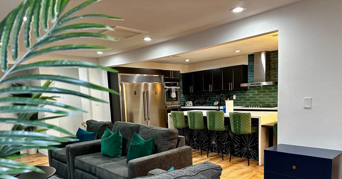 Shared living room and kitchen island at a vegasbnb Las Vegas vacation home for groups